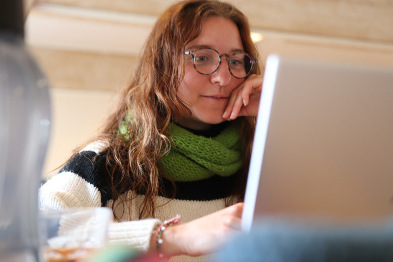 Student behind laptop